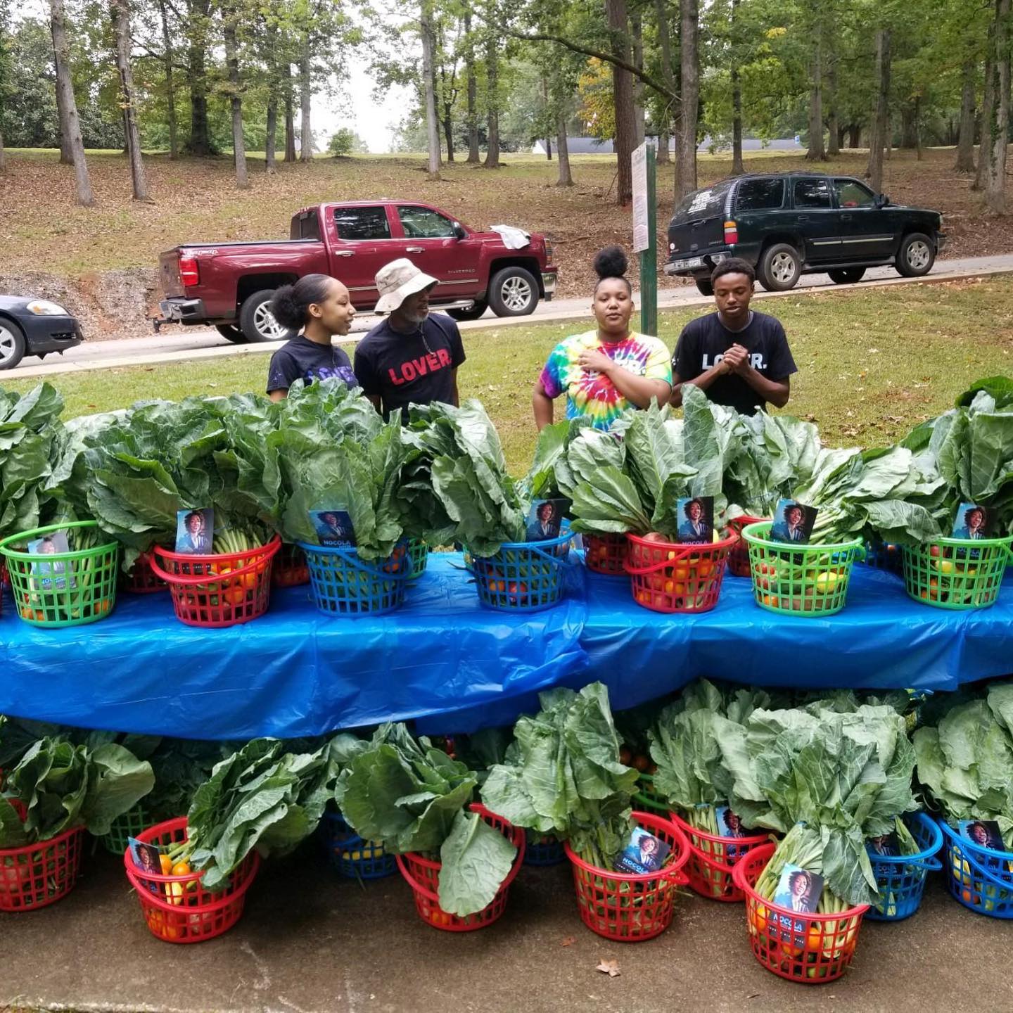 Youth and community members with fresh produce